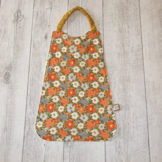 Serviette élastique imprimé fleurs orange et bleues